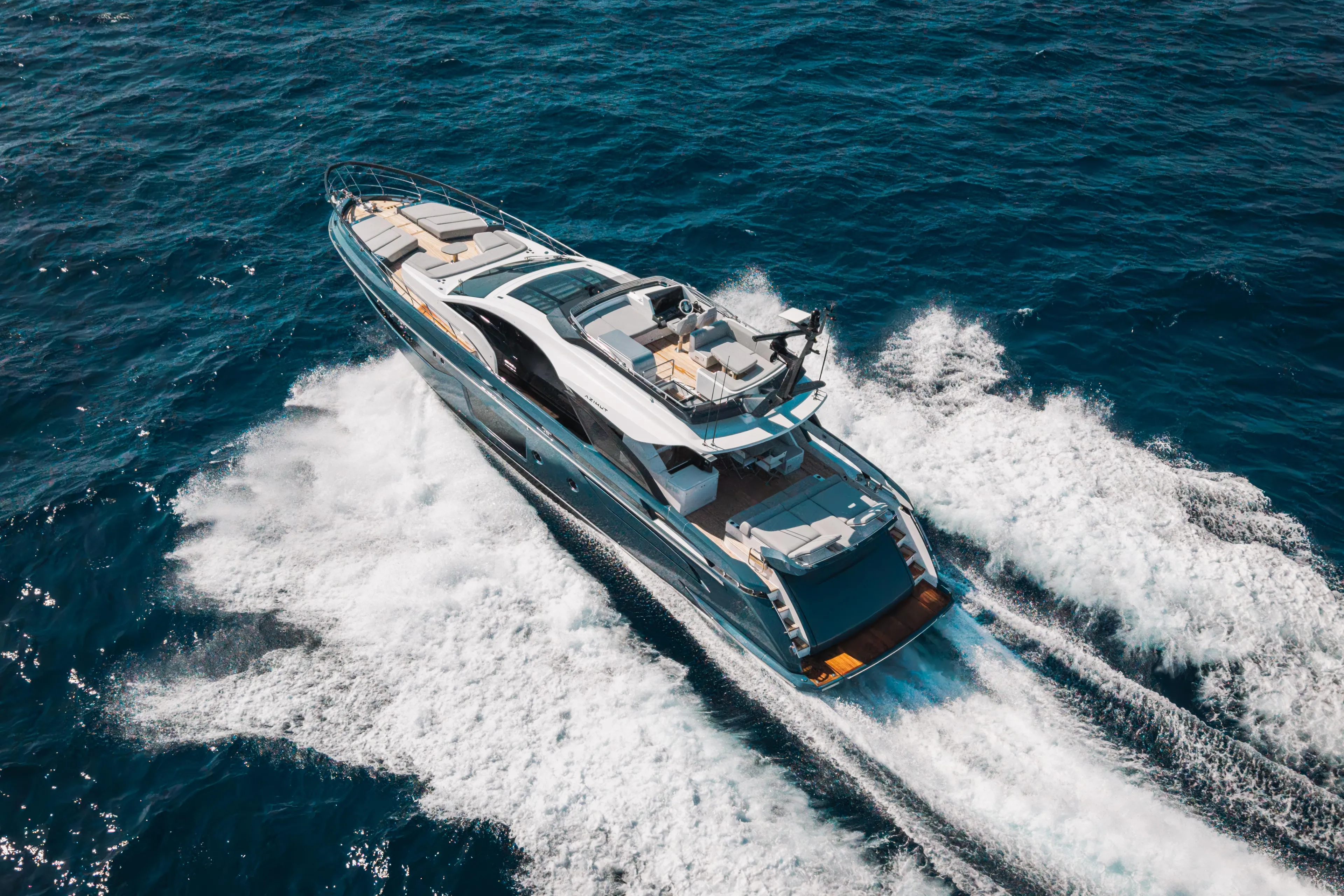  Yacht Photos Pics Luxurious 2025 Azimut S8 yacht cruising on open sea, showcasing sleek design and elegance.