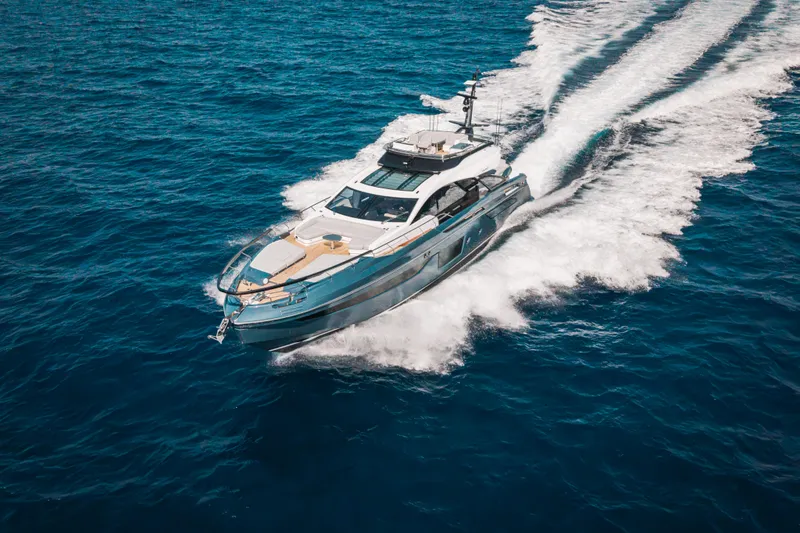  Yacht Photos Pics 2025 Azimut S8 yacht cruising on open blue sea, showcasing luxury and speed.