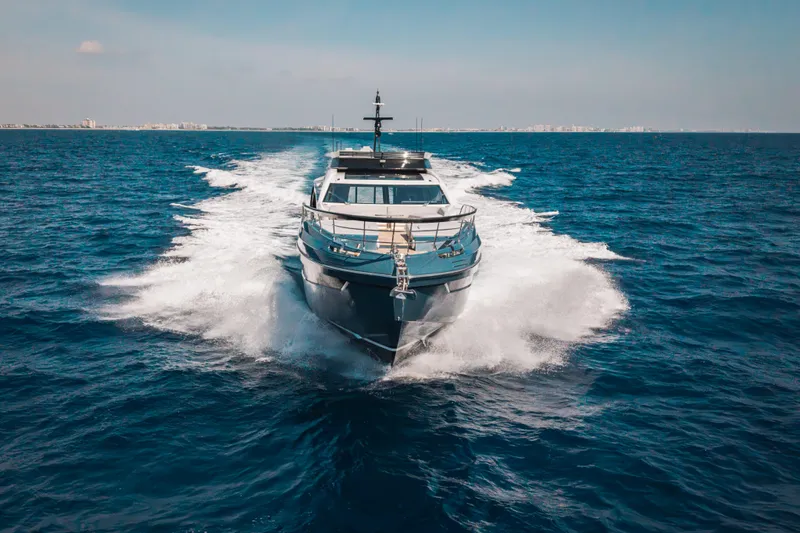  Yacht Photos Pics 2025 Azimut S8 yacht cruising on open sea, creating dynamic water splashes.