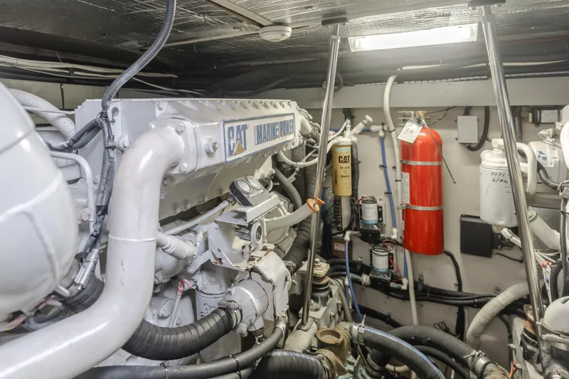 Ranger Yacht Photos Pics Engine room of 2000 Sea Ray 540 Sundancer with CAT marine engine and fire extinguisher.