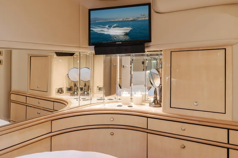 Ranger Yacht Photos Pics Luxurious interior of 2000 Sea Ray 540 Sundancer yacht with TV and elegant cabinetry.