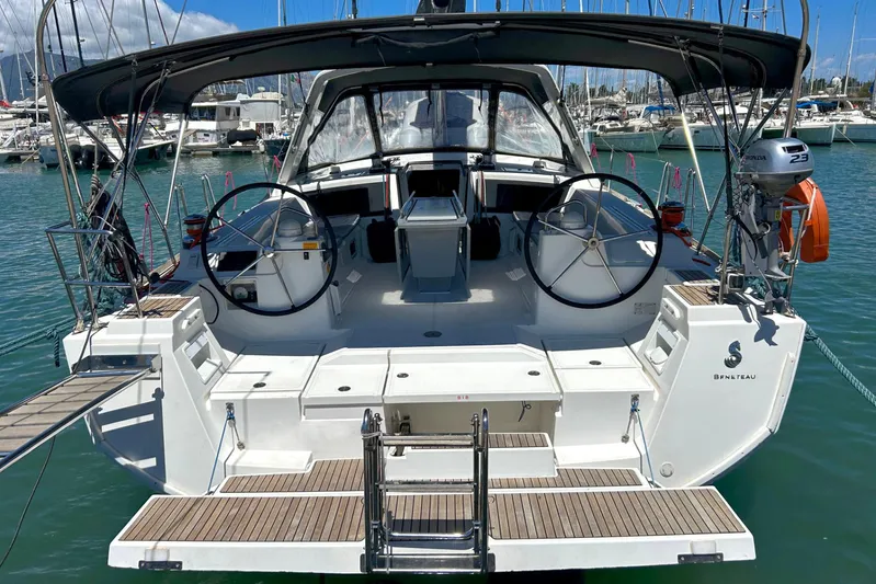  Yacht Photos Pics 2015 Beneteau Oceanis 48 yacht with dual steering wheels docked at marina.