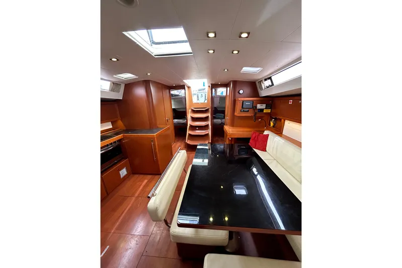  Yacht Photos Pics Interior of 2015 Beneteau Oceanis 48 yacht, featuring elegant wood finishes and modern amenities.