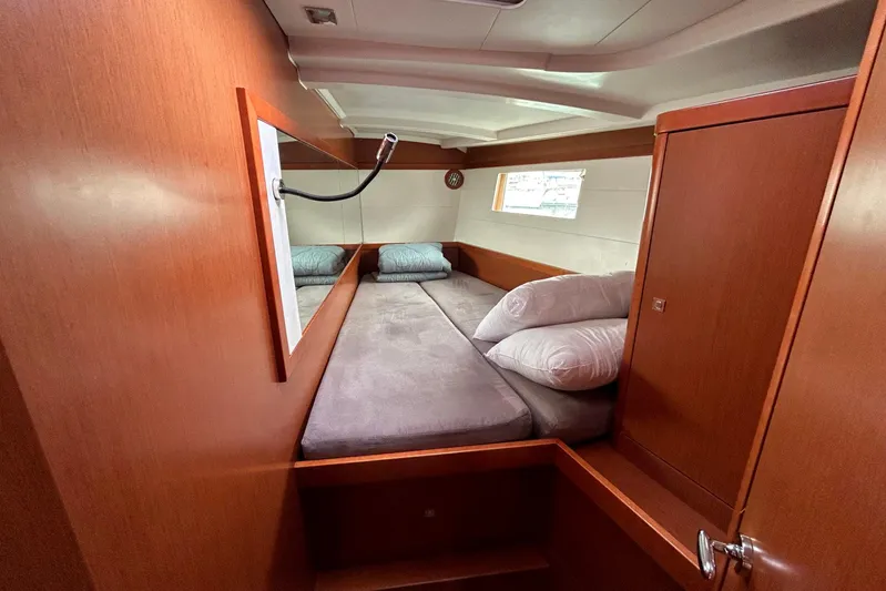  Yacht Photos Pics Cozy cabin interior of 2015 Beneteau Oceanis 48 yacht with comfortable bedding.