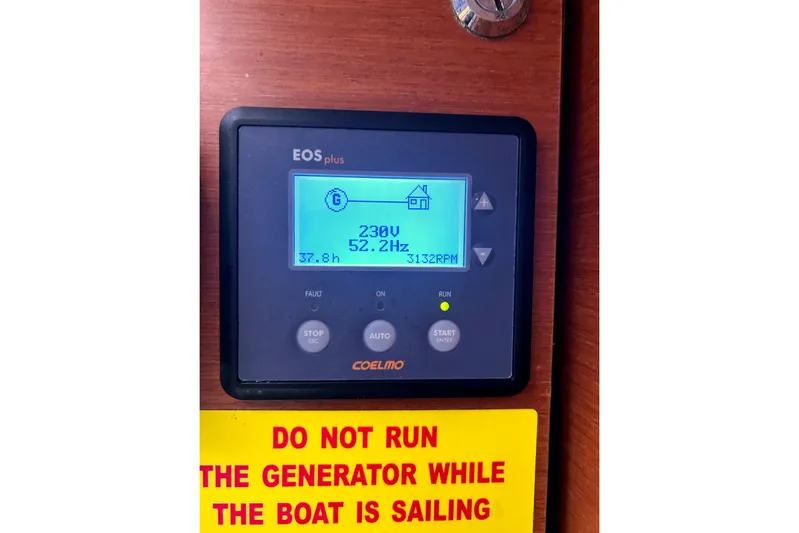  Yacht Photos Pics Control panel on 2015 Beneteau Oceanis 48 with generator warning sign.