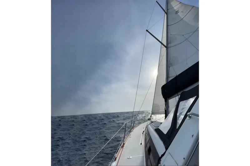  Yacht Photos Pics Sailing on a 2015 Beneteau Oceanis 48 yacht under clear skies.
