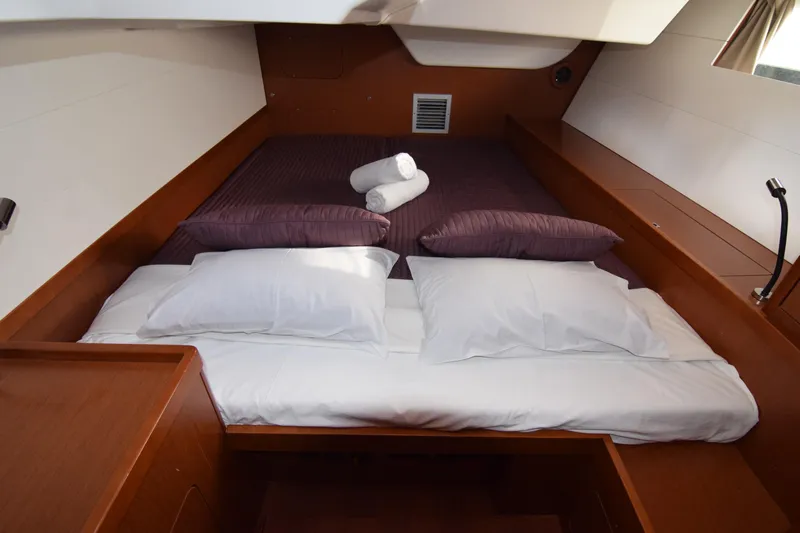  Yacht Photos Pics Luxurious cabin interior of 2015 Beneteau Oceanis 48 yacht with cozy bedding.