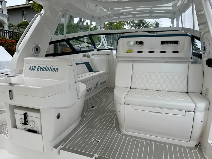  Yacht Photos Pics 2023 Intrepid 438 Evolution boat interior with white seating and modern design.