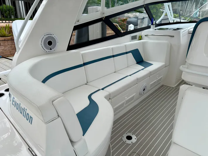  Yacht Photos Pics 2023 Intrepid 438 Evolution yacht interior with sleek white seating and modern design.