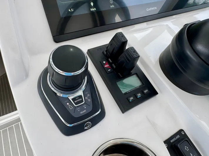  Yacht Photos Pics Control panel of 2023 Intrepid 438 Evolution boat with joystick and digital display.