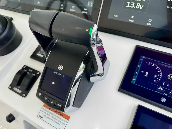  Yacht Photos Pics Control panel of 2023 Intrepid 438 Evolution boat with digital displays and throttle.