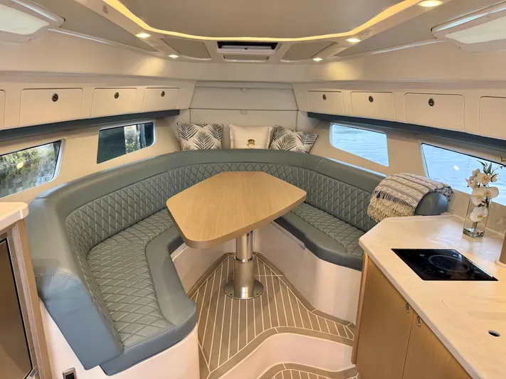  Yacht Photos Pics Luxurious interior of 2023 Intrepid 438 Evolution yacht with elegant seating and modern amenities.