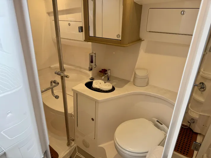  Yacht Photos Pics Luxurious bathroom in 2023 Intrepid 438 Evolution yacht, featuring modern fixtures and elegant design.