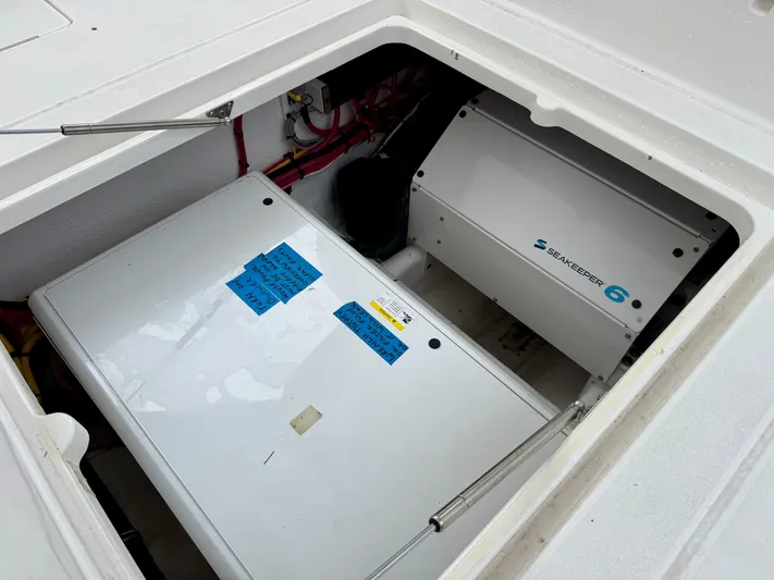  Yacht Photos Pics 2023 Intrepid 438 Evolution boat compartment with Seakeeper 6 stabilizer system.