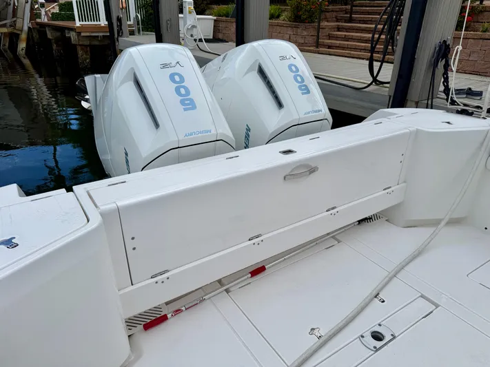  Yacht Photos Pics 2023 Intrepid 438 Evolution boat with twin Mercury 600 outboard engines at dock.