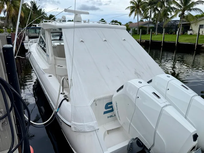  Yacht Photos Pics 2023 Intrepid 438 Evolution boat docked, featuring dual outboard engines.