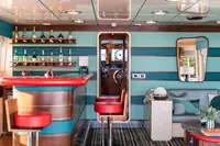 Luxurious interior of 1986 38m Nicolini motor yacht with bar and seating area.