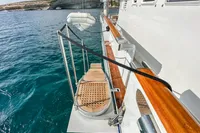 38m Nicolini Motor Yacht, 1986, with wooden deck and ocean view.