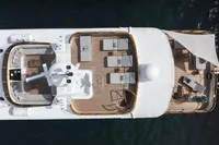 Aerial view of 1986 Motor Yacht 38m Nicolini with sun loungers and shaded deck area.