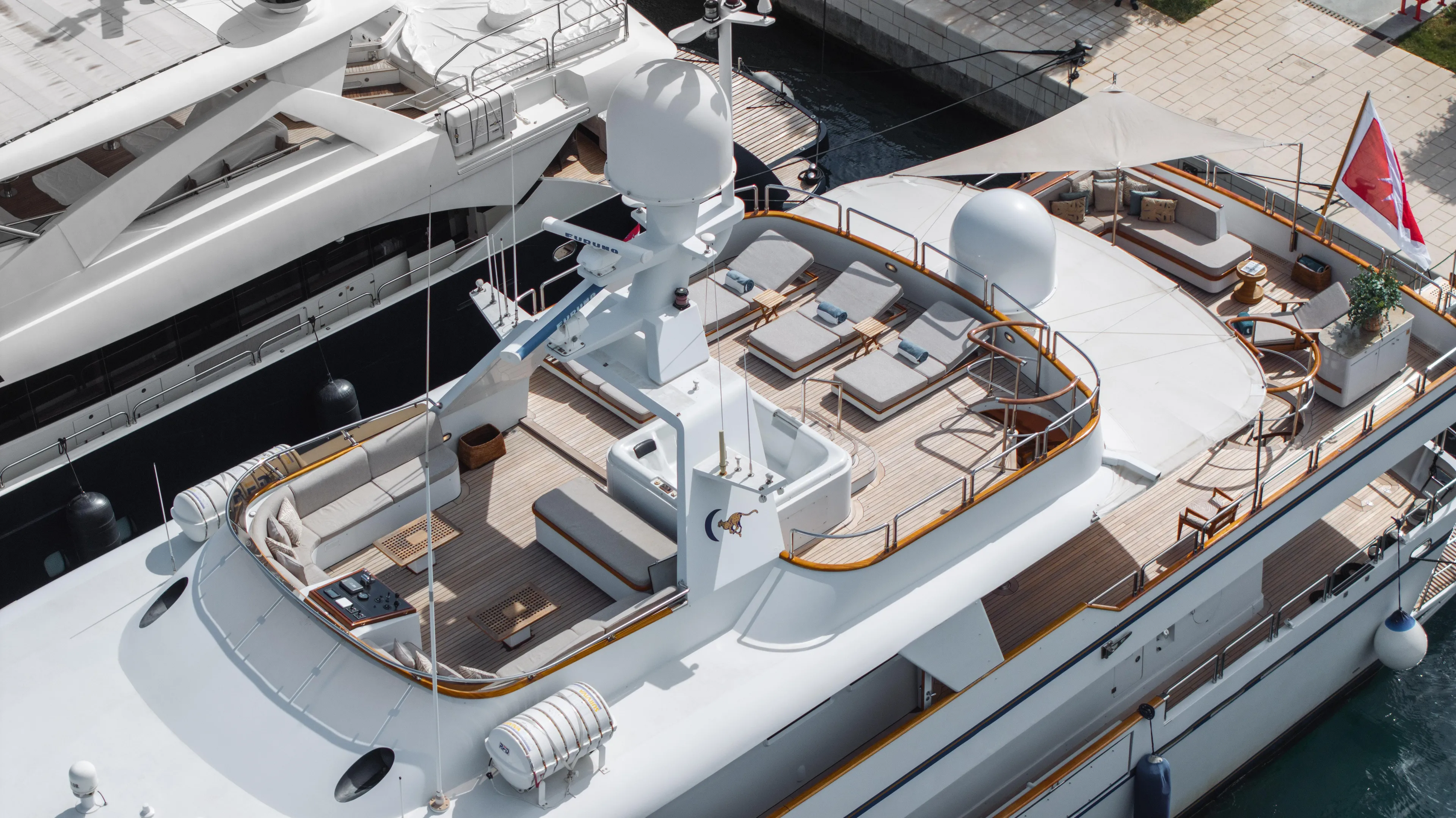 Luxurious 1986 38m Nicolini motor yacht with spacious deck and elegant seating area.