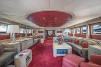 Luxurious interior of 1986 Motor Yacht 38m Nicolini with elegant red and beige decor.