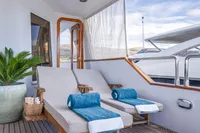 Luxurious deck of 1986 Motor Yacht 38m Nicolini with sun loungers and towels.