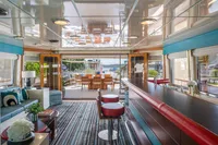Luxurious interior of 1986 Motor Yacht 38m Nicolini with elegant seating and dining area.