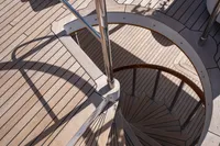 Spiral staircase on 1986 Motor Yacht 38m Nicolini with wooden deck.