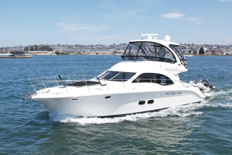 One Shot Yacht Photos Pics 2007 Sea Ray 52 Sedan Bridge yacht cruising on open water.