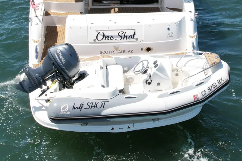 One Shot Yacht Photos Pics 2007 Sea Ray 52 Sedan Bridge with Zodiac tender and Yamaha motor on water.