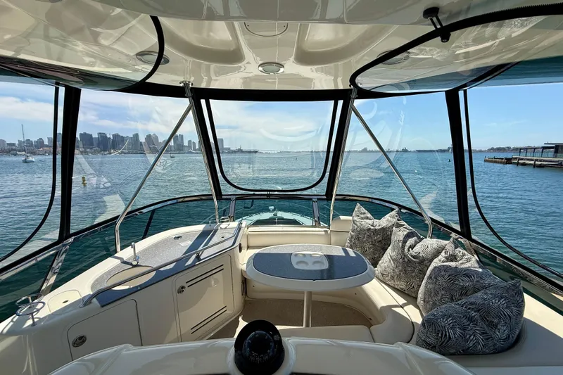 One Shot Yacht Photos Pics Interior view of 2007 Sea Ray 52 Sedan Bridge yacht with city skyline.