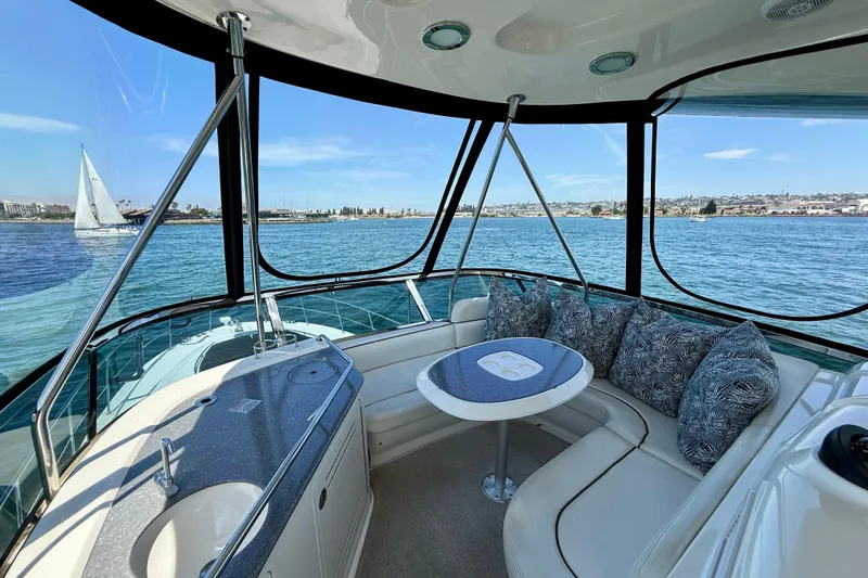One Shot Yacht Photos Pics Luxurious 2007 Sea Ray 52 Sedan Bridge interior with ocean view and comfortable seating.