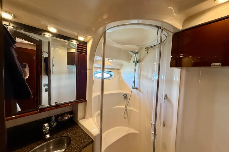One Shot Yacht Photos Pics Luxurious bathroom in 2007 Sea Ray 52 Sedan Bridge yacht with modern shower and vanity.