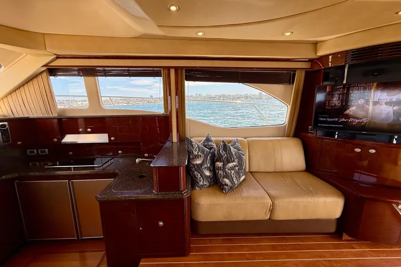 One Shot Yacht Photos Pics Luxurious interior of 2007 Sea Ray 52 Sedan Bridge yacht with scenic ocean view.