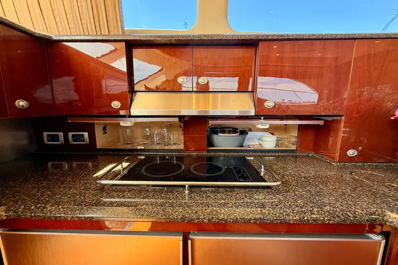 One Shot Yacht Photos Pics Luxurious kitchen interior of 2007 Sea Ray 52 Sedan Bridge yacht with modern appliances.