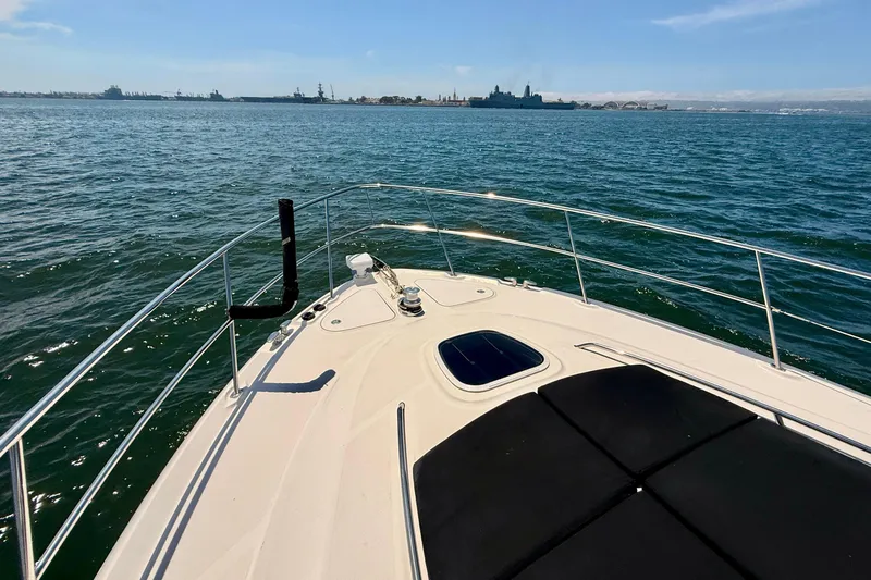 One Shot Yacht Photos Pics Bow view of 2007 Sea Ray 52 Sedan Bridge yacht on open water.