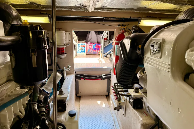 One Shot Yacht Photos Pics Engine room of a 2007 Sea Ray 52 Sedan Bridge yacht, showcasing machinery and equipment.