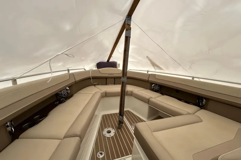 Sand Piper Yacht Photos Pics 2017 Formula 350 Crossover Bowrider interior with beige seating and wood accents.