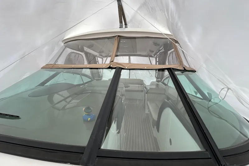 Sand Piper Yacht Photos Pics 2017 Formula 350 Crossover Bowrider interior view through windshield, under protective cover.