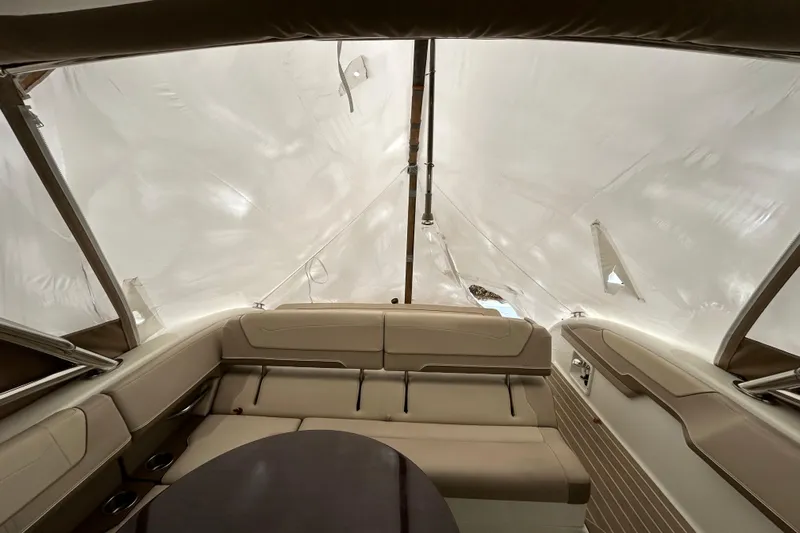 Sand Piper Yacht Photos Pics Interior of 2017 Formula 350 Crossover Bowrider with beige seating and covered canopy.
