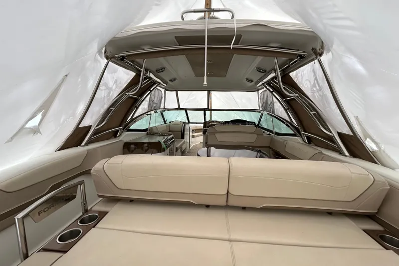 Sand Piper Yacht Photos Pics 2017 Formula 350 Crossover Bowrider interior with beige seating and sleek design.