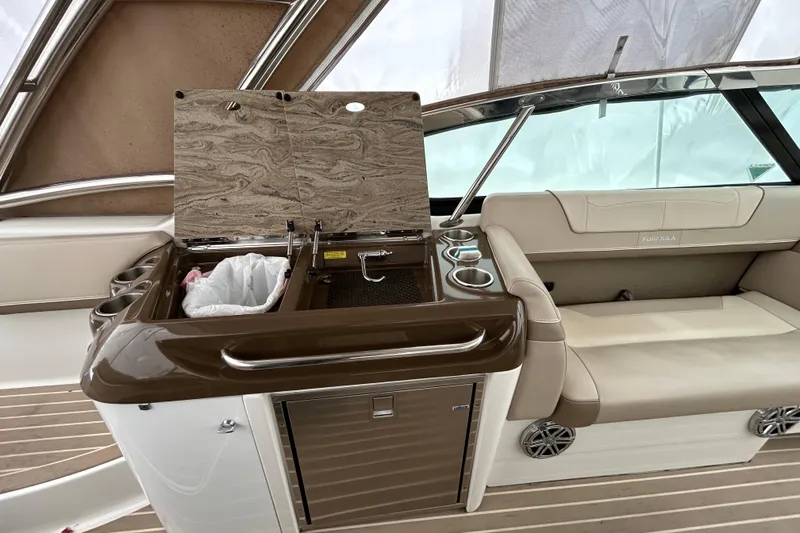 Sand Piper Yacht Photos Pics 2017 Formula 350 Crossover Bowrider interior with kitchenette and seating area.