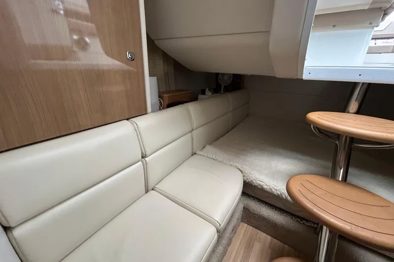 Sand Piper Yacht Photos Pics Interior of 2017 Formula 350 Crossover Bowrider, featuring cozy seating and wooden accents.