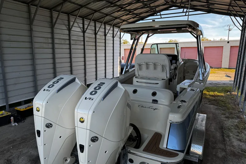  Yacht Photos Pics 2019 Chris-Craft Catalina 26 boat with twin 200 V6 engines in a covered storage.