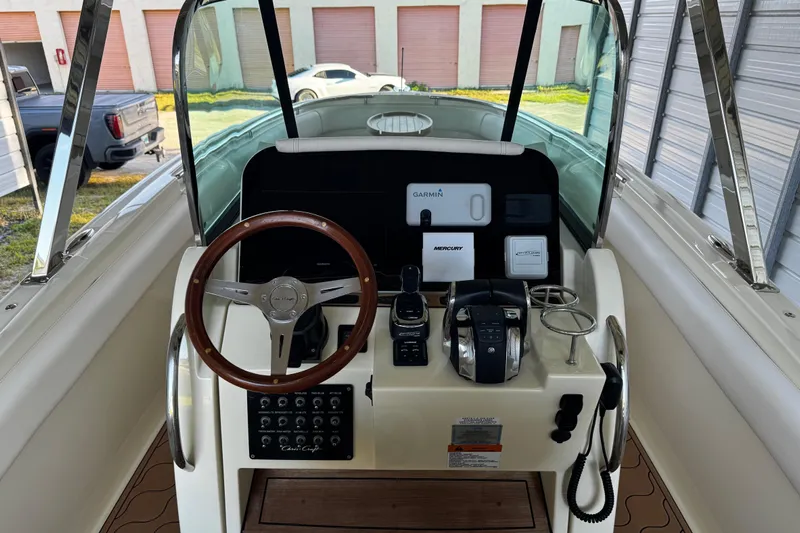  Yacht Photos Pics 2019 Chris-Craft Catalina 26 helm with Garmin navigation and Mercury controls.