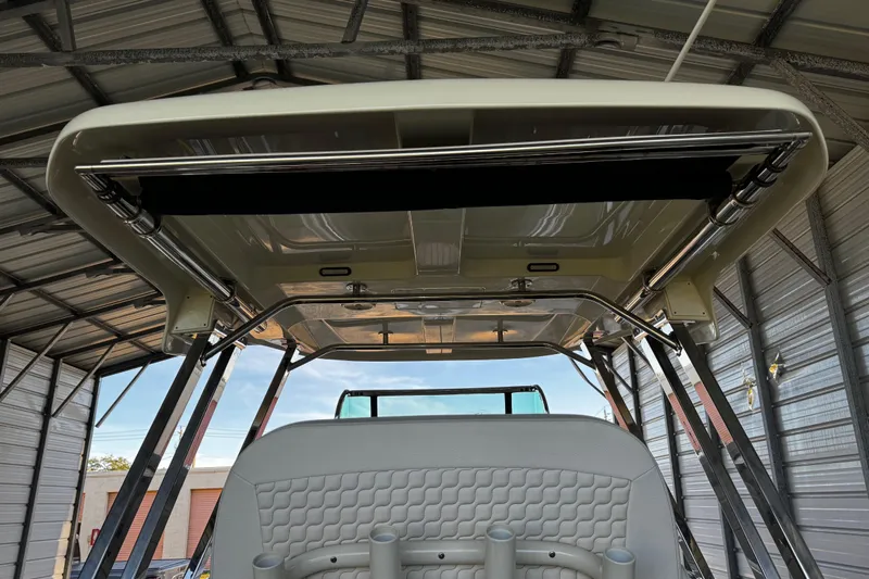  Yacht Photos Pics 2019 Chris-Craft Catalina 26 boat interior with sleek design under a metal canopy.