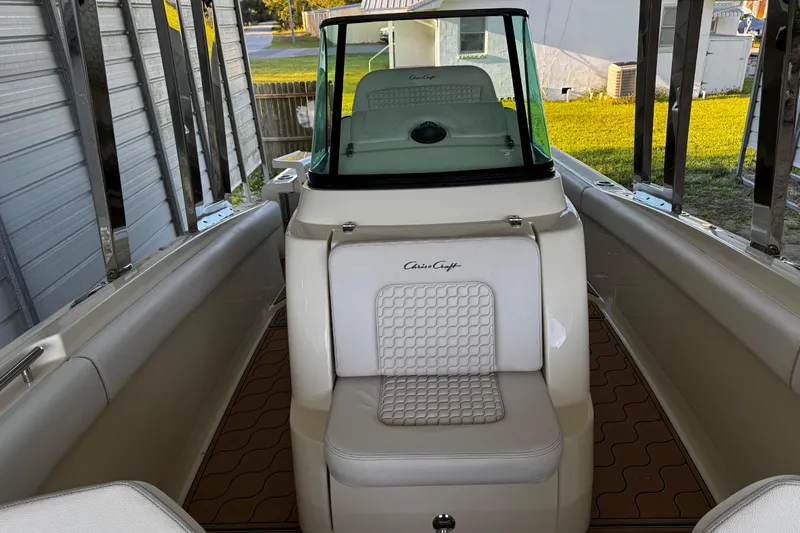  Yacht Photos Pics 2019 Chris-Craft Catalina 26 boat interior with white seating and windshield.