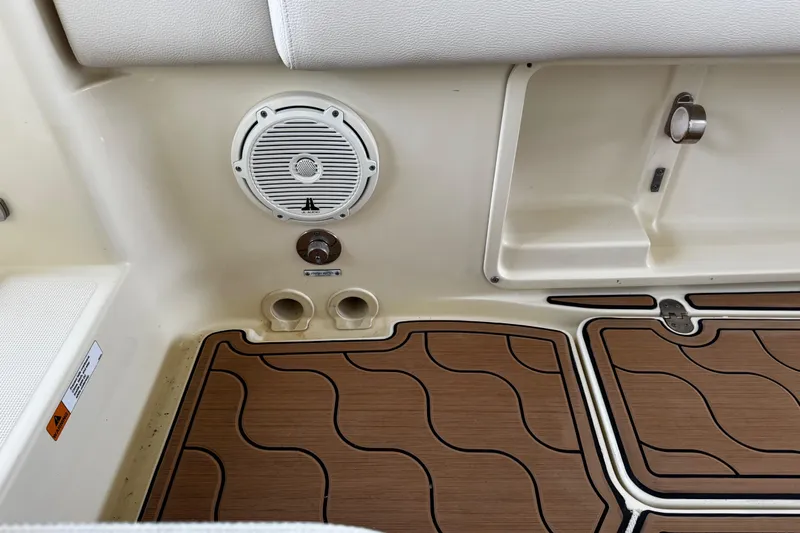  Yacht Photos Pics 2019 Chris-Craft Catalina 26 interior with speaker and teak-style flooring.
