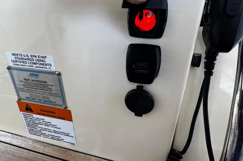 Yacht Photos Pics 2019 Chris-Craft Catalina 26 control panel with certification and warning labels.