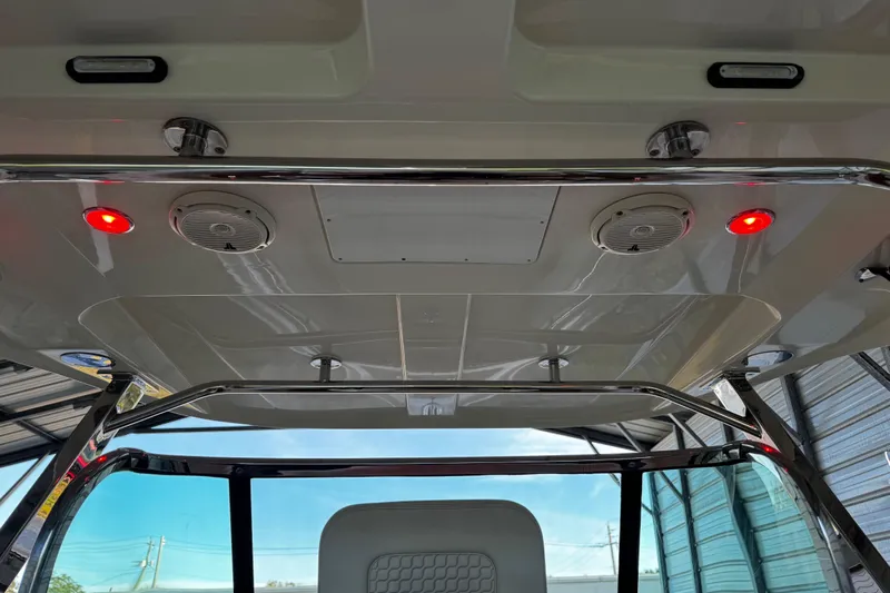  Yacht Photos Pics 2019 Chris-Craft Catalina 26 boat interior with red lights and speakers on the ceiling.